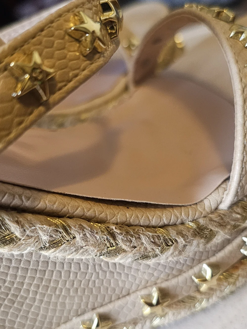 Brand new and never worn, but please note there is a minor scuff/dark mark on th
